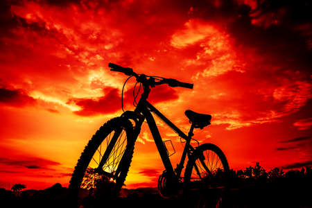 Beautiful close up scene of bicycle at sunsetの写真素材