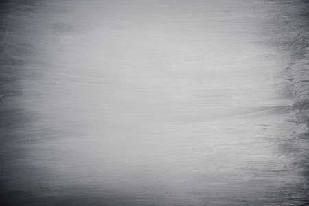 Chalk rubbed out on board, Black background.の写真素材