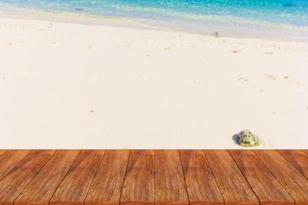 Wood table top on blurred beach background - can be used for display or montage your products
