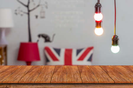 Wood table top and blurred restaurant background - can used for display or montage your products.の写真素材