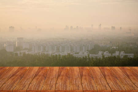 Empty wooden table over cityscape for your product display montageの写真素材