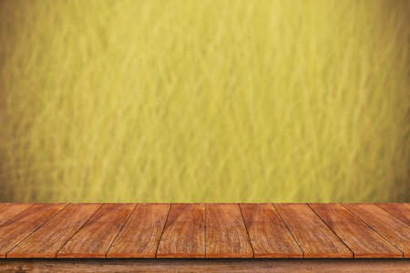 Wood table top on blurred grass background - can be used for display or montage your productsの写真素材