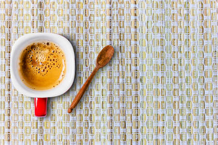 Top view cup of coffee on burlap surfaceの写真素材