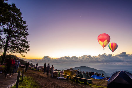 Colorful hot-air balloons flying over the mountain