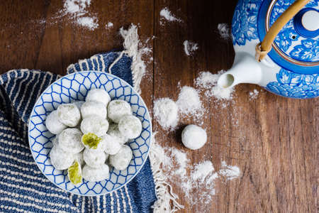 Coconut pandan ball in ceramic bowl on tableの写真素材