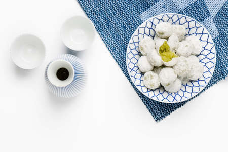 Coconut pandan ball in ceramic bowl on tableの写真素材