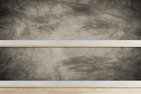 Empty wood shelf on concrete wall backgroundの写真素材