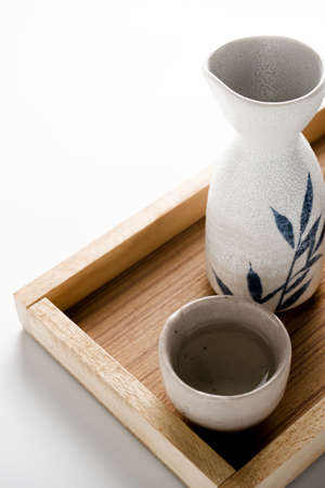 Close up of Japanese Sake drinking set on table background.の写真素材