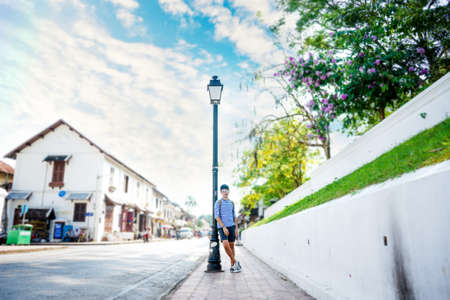 Asian young man traveling backpacker in Street old town ,Luang Prabang, Loasの写真素材