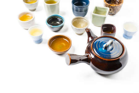 Cup of tea with teapot isolated on white backgroundの写真素材