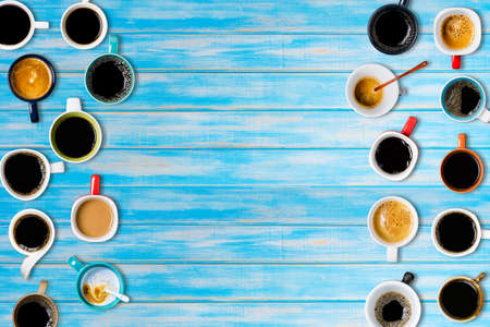 Many cups of coffee on blue background. Top viewの写真素材