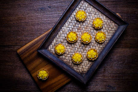 Kanom Jamongkut is a kind of crown-like yellow sweetmeat mainly made of yolk and sugar. thai dessertの写真素材