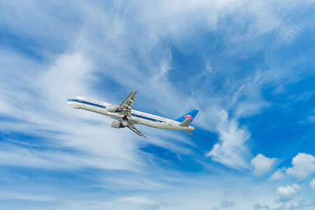 Phuket - Thailand - Otober 23,2017 :China Southern Airbus 330-300 airplane flying take off at Phuket airport over the Mai Khao beach in Thailand.のeditorial素材