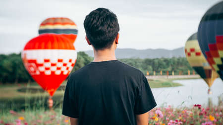 Asian young man is enjoy watchingの写真素材