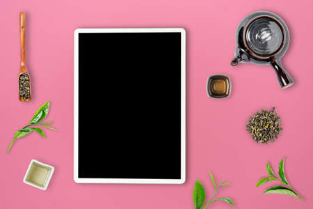 Green tea in tea pot on white background. top viewの写真素材