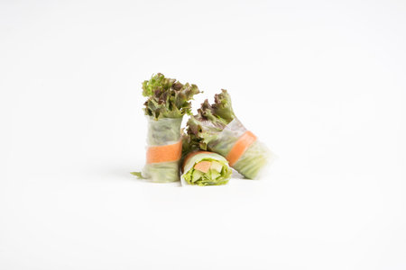 Fresh cut salad rolls isolated on white background