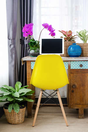 The house has a working desk with a tree.の写真素材