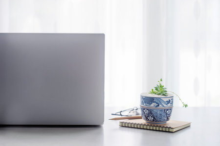 Office desk table with laptop computer, supplies with copy space in the office.