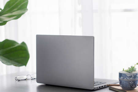 Office desk table with laptop computer, supplies with copy space in the office.の写真素材