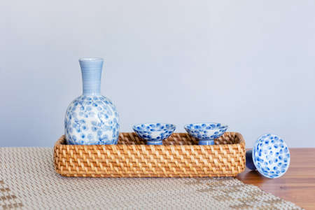 Close up of Japanese Sake drinking set on a white background.の写真素材