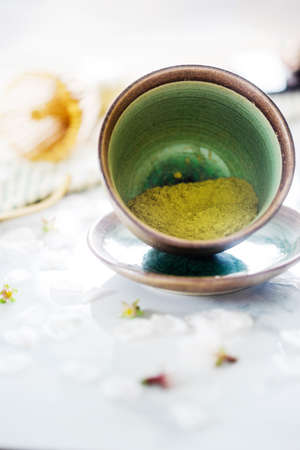 green tea matcha in a bowl on tableの写真素材