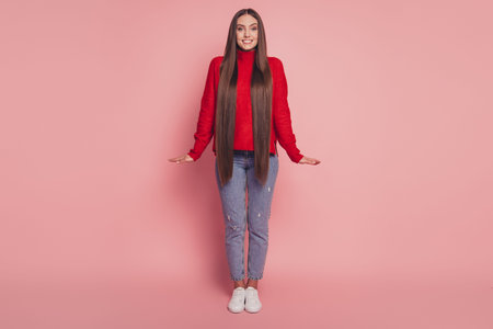 Full length photo of charming girl good mood standing over pink background