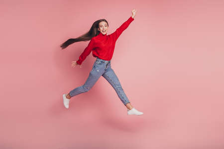 Full body photo of jumping high lady running rushing wear casual clothesの写真素材