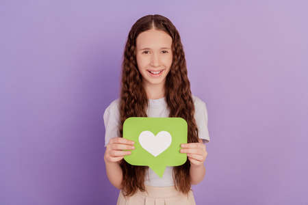 Photo of young girl hold reaction icon like isolated over purple backgroundの写真素材