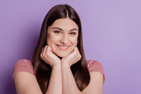 Close up photo of nice attractive girl toothy smile hands touch chin isolated over violet color...