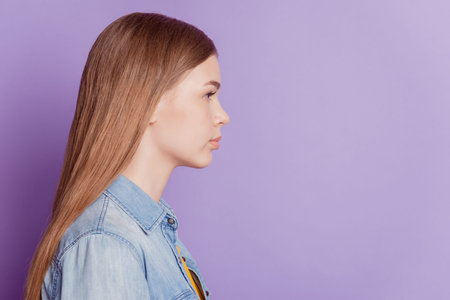 Profile photo of calm smart charming girl look empty space on purple background