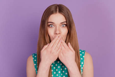 Photo of crazy surprised lady open mouth look camera on purple backgroundの写真素材