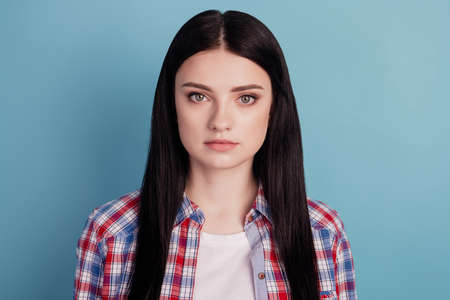 Photo of young attractive business woman confident casual outfit isolated over teal color backgroundの写真素材