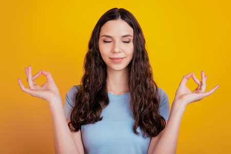 Portrait of charming youth feel content good looking meditate dream yoga balance isolated colorful backgroundの写真素材