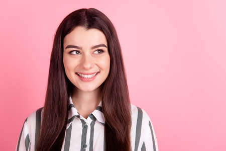 Photo of pretty youth lady wondered look empty space thoughtful idea isolated over pink color backgroundの写真素材