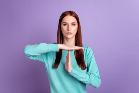 Photo of young lattractive woman confident show hands time out stop symbol isolated over violet...