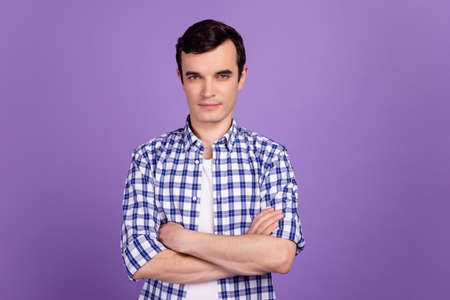 Photo of young handsome man crossed hands intelligent boss leader isolated over violet color backgroundの写真素材