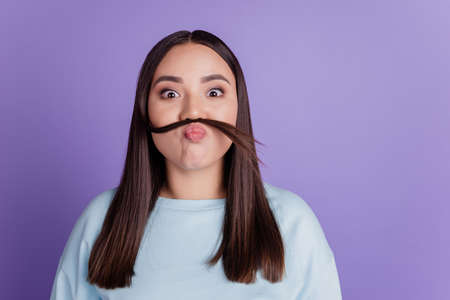 Funny positive lady send air kiss make fake mustache curl valentine day conceptの写真素材