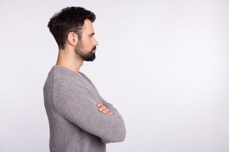 Profile side photo of young man folded hands look empty space serious clever chief isolated over...