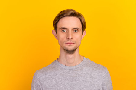 Portrait of serious masculine man freelancer good look wear stylish clothes isolated over bright color backgroundの写真素材