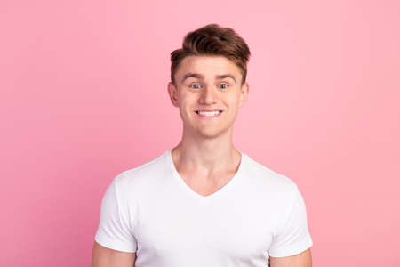 Studio shot portrait of positive cheerful man beaming smiling in camera pciture isolated pastel color backgroundの写真素材