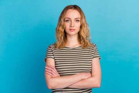 Photo of cool attractive business lady arms crossed wear casual outfit isolated blue color backgroundの写真素材