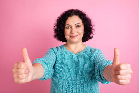 Photo portrait of senior woman showing two thumbs up hands gesture smiling isolated pastel color backgroundの写真素材