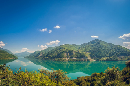 beautiful mountain landscape in Georgia lake with turquoise waterの写真素材