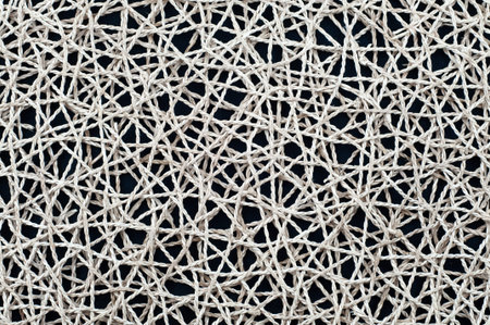 the background of braided spiral natural fiber ropes, close-up