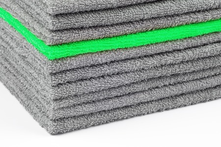 stack of gray and green terry towels, conceptual background, close-upの写真素材