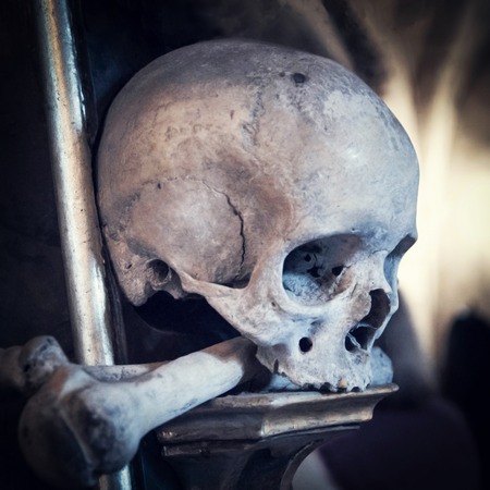 A combination of human skulls and bones, symbolizing death, evil, darkness and piracy.の写真素材