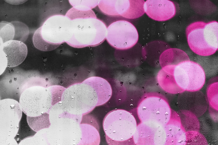 water droplets on glass with blurred boke in the backgroundの写真素材