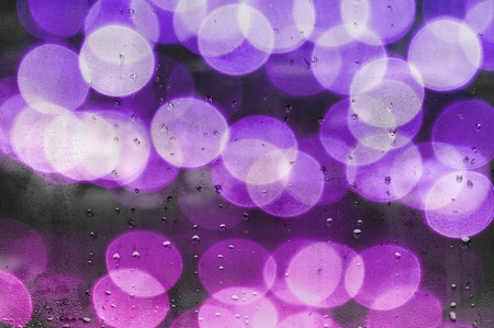 water droplets on glass with blurred boke in the backgroundの写真素材