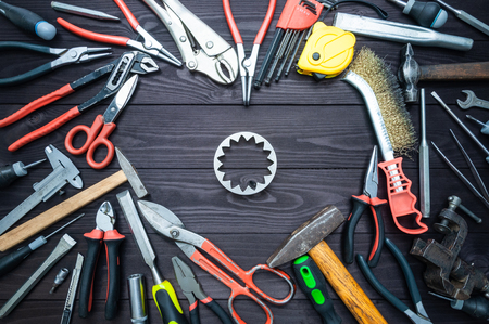 Tool gears and heart on a dark wooden background. Concept Love for your work, Father's Day.の写真素材