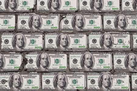 Realistic wall of blocks in the form of dollars. Bricks from money art concept.の写真素材